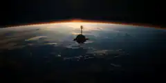 Space station orbiting Earth at sunrise