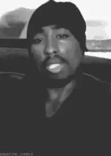 2Pac smoking a cigarette