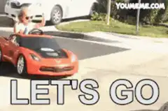 Toddler in toy car with 'LET'S GO' text