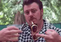 Man smoking pipe and pointing