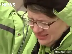 Person in green jacket screaming