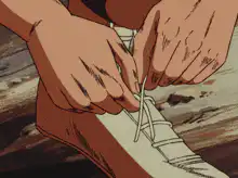 Anime character tying shoes and sprinting