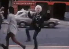 Johnny Rotten dancing on the street