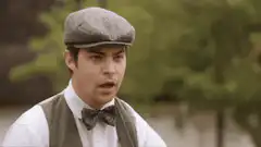 Man in cap rubbing eyes in shock