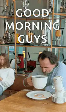 Man drinking coffee with stacked cups
