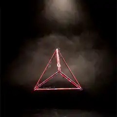 Red neon triangle light in smoke