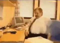 Man throws papers off desk