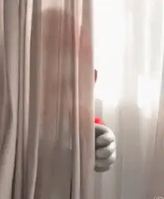 Mario peeking from behind curtain