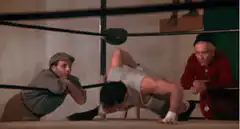 Rocky doing pushups in the ring
