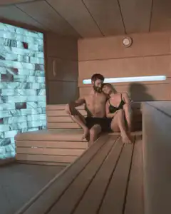 Couple relaxing in a sauna