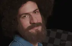 Bob Ross gives an okay sign