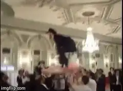 man crowd surfing at wedding