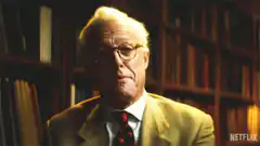 Michael Caine adjusting glasses