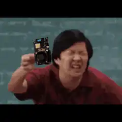 Ken Jeong holding a Bitcoin camera