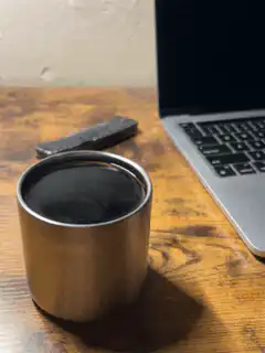 Steam rising from a metal cup