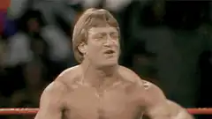 Hulk Hogan flexes and wipes sweat