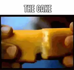 Hands pulling apart yellow cake