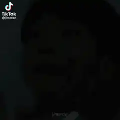 Man crying while being held by the face