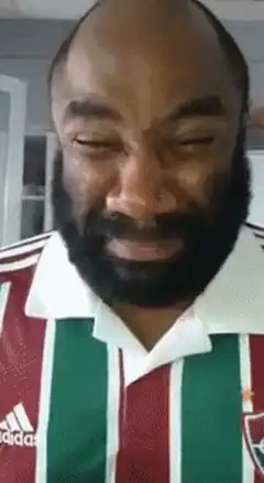 Man in soccer jersey crying and screaming