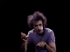 Man miming playing piano