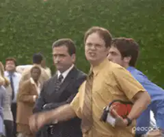 Dwight Schrute throws a rock