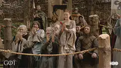 Sansa Stark clapping with crowd