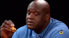 Shaquille O'Neal eating a chicken nugget