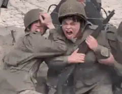 Soldier screaming while being held back