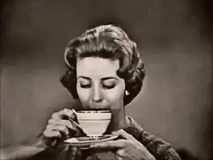 Woman drinking tea and smiling