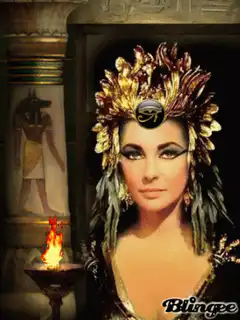 Elizabeth Taylor as Cleopatra with flickering torch