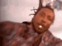 2 Chainz dancing on a pier
