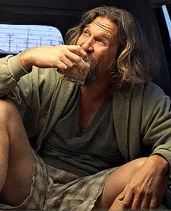The Dude drinking from a glass