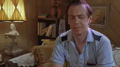 Steve Buscemi writing a list on a wall