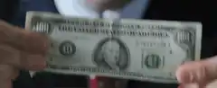 Leonardo DiCaprio throws hundred dollar bill in trash