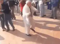 Old man dancing in public