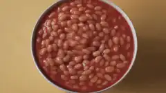 Bowl of baked beans bubbling