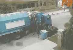 garbage truck spills trash