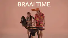 Man and woman at a braai with text