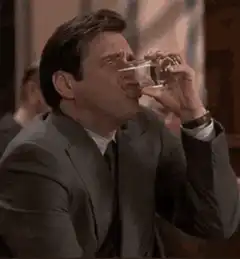 Michael Scott spits out water