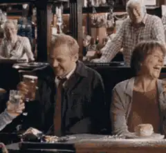 Tony Wilson laughing with beer