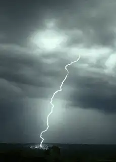 Lightning bolt strikes from storm clouds