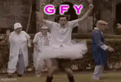 Man in tutu dancing with arms raised