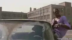Woman dancing by car