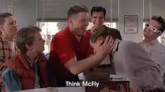 Biff grabs George Think McFly