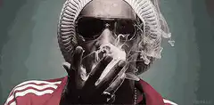Snoop Dogg smoking and exhaling smoke