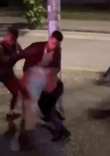 man does a backflip on the street