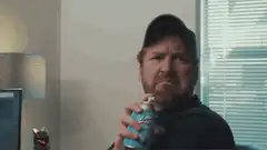 Drew Carey holding a spray can