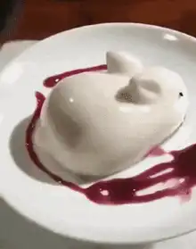 spoon scooping white rabbit dessert