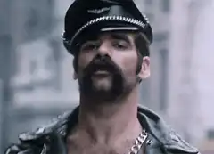 Man in police hat and leather jacket