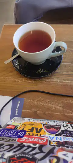 Tea cup on saucer with stickers